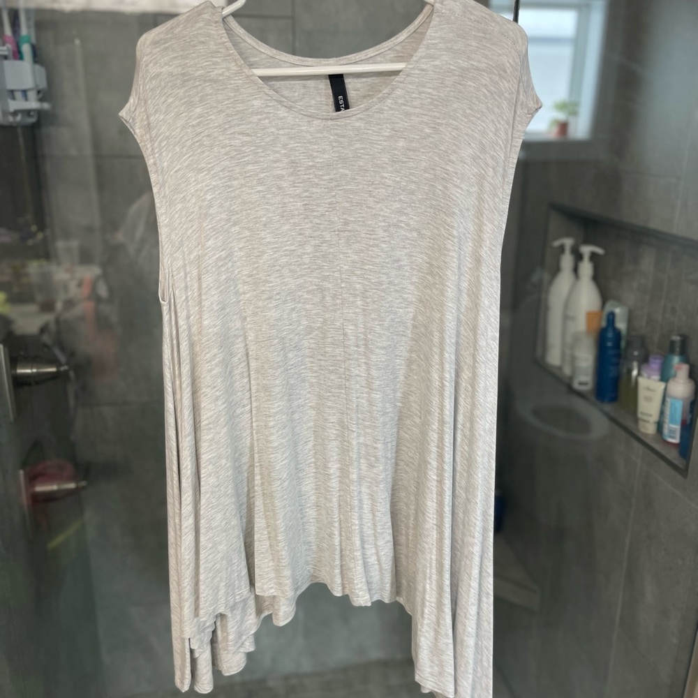 Light gray flowy top.